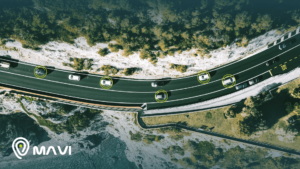 Vista aérea de autos circulando por carretera con sistema de gps auto activo, mostrando monitoreo y rastreo vehicular en tiempo real.